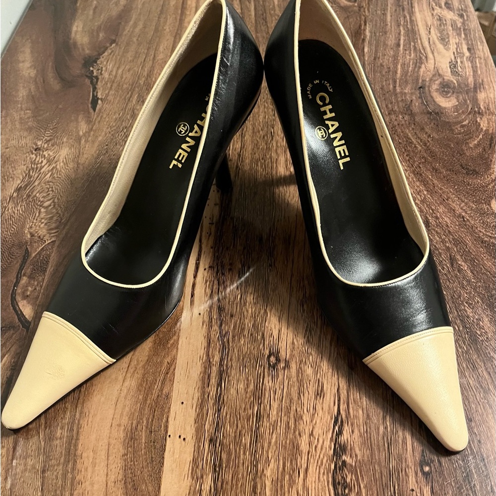 Never worn authentic vintage 2 inch Chanels. Missing tap one shoe.